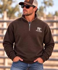 Model wearing chocolate brown Ranchy Threads quarter-zip pullover
